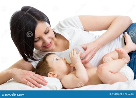 Mother Feeding Baby By Milk From Bottle Stock Photo - Image: 39037029