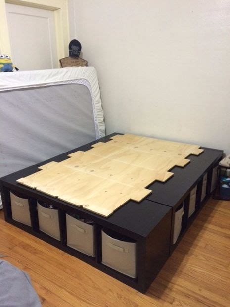 A bed made from 3 storage cubes and a piece of plywood.... Brilliant ...