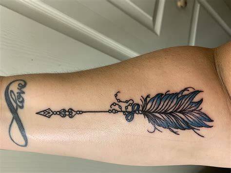 Arrow Tattoo | Feather tattoo design, Feather tattoo meaning, Tattoos ...