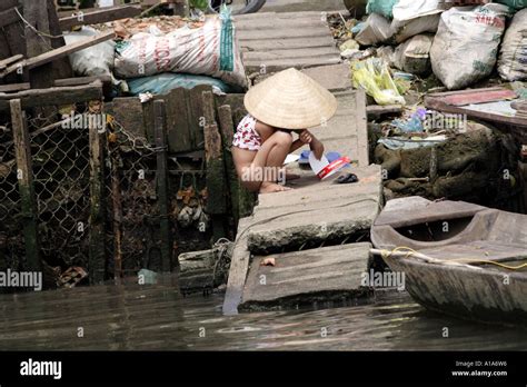 Little Girl using the River Dock as a Toilet, Mekong Delta, Vietnam ...