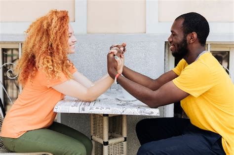 Free Photo | Side view of couple holding hands