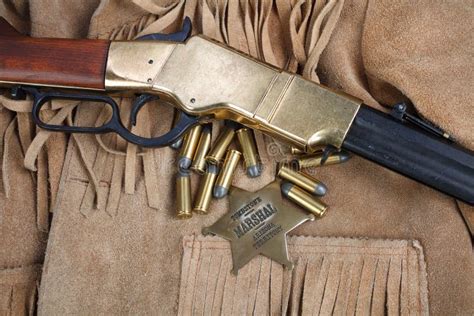 Wild West Repeating Rifle with Ammunition and Sheriff Badge Stock Photo - Image of safety ...