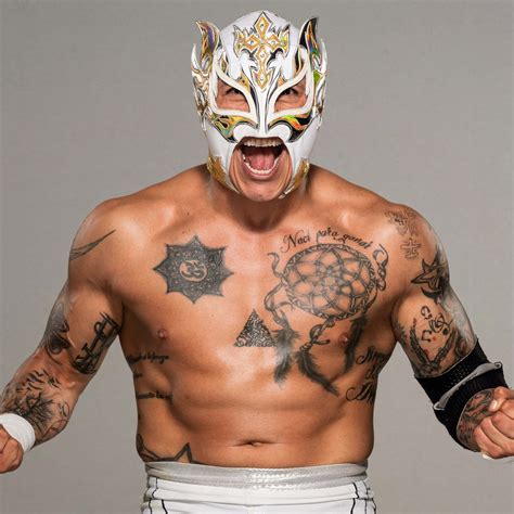 Download Rey Fenix Wrestler Flexing Photo White Mask Wallpaper | Wallpapers.com