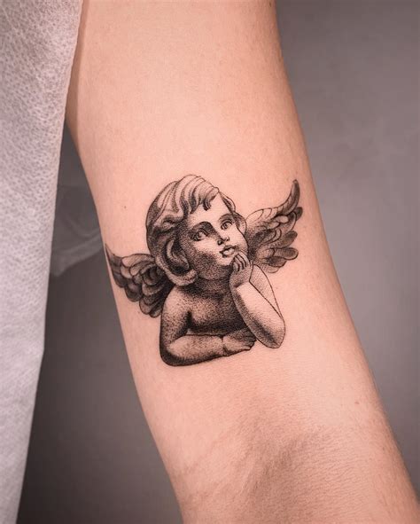 Details 74+ cherub tattoo designs best - in.coedo.com.vn