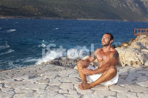 Muscular Man Meditating In A Yoga Pose Stock Photo | Royalty-Free | FreeImages