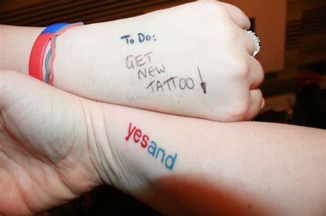 two people with tattoos on their arms that say to do get new tattoo and yes and don't