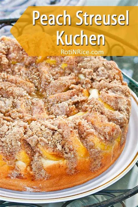 a peach streusel kuchen on a white plate