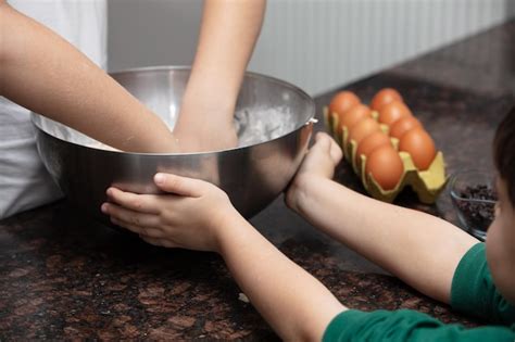 Premium Photo | Close up child hands preparing cookies at kitchen