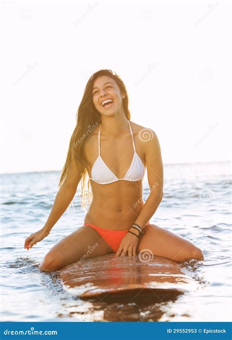 Surfer Girl At Sunset In Hawaii Stock Photos - Image: 29552953