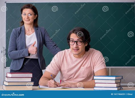 Old Female Teacher and Male Student in the Classroom Stock Image - Image of exam, green: 161746659