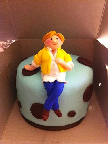 Blue & brown baby shower | Cake topped with pregnant lady to… | Flickr