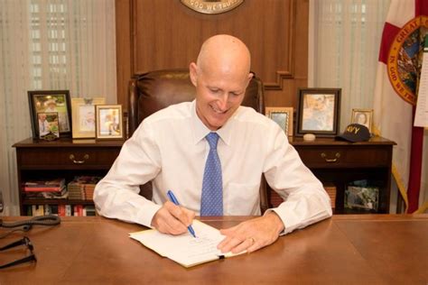 Rick Scott signs 20 bills into law