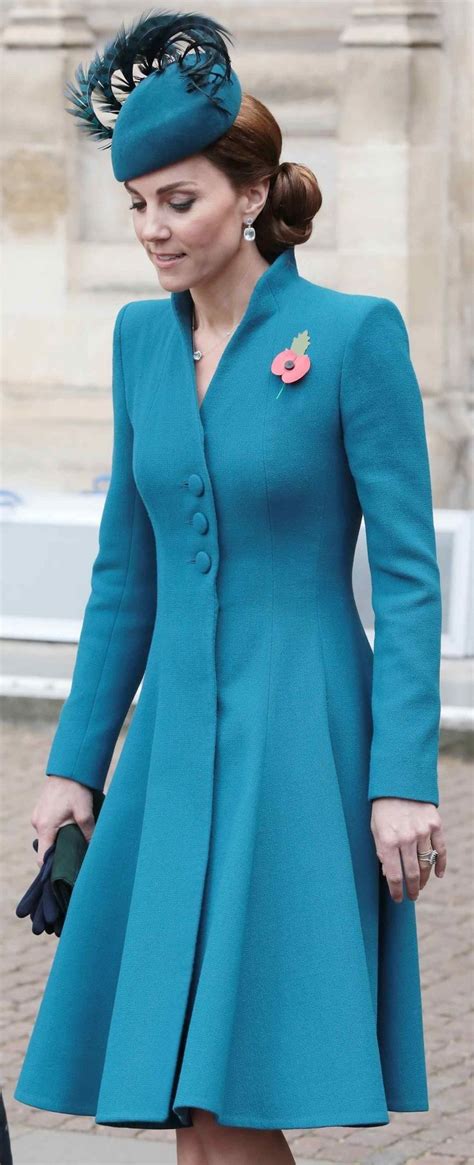 the woman is wearing a blue coat and hat