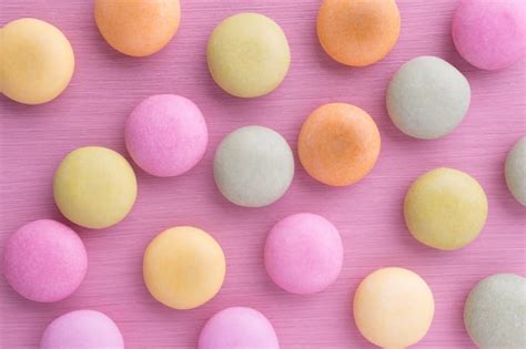 Premium Photo | Small round candy-colored pastels on pastel