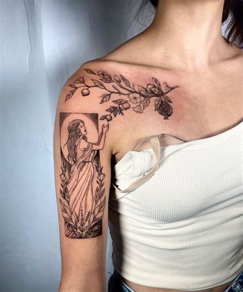 a woman with a cross and flowers tattoo on her left upper arm, wearing a white top