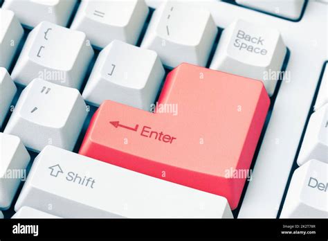 Keyboard with red Enter key Stock Photo - Alamy