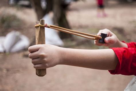 Hand boy pulling sling shot | Slingshot, Shoot tips, Diy slingshot