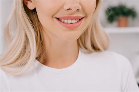 Premium Photo | Cropped view of blonde woman with toothy smile