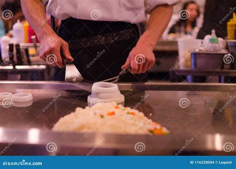 Hibachi Restaurant Chef Preparing Meal and Entertaining Guests ...