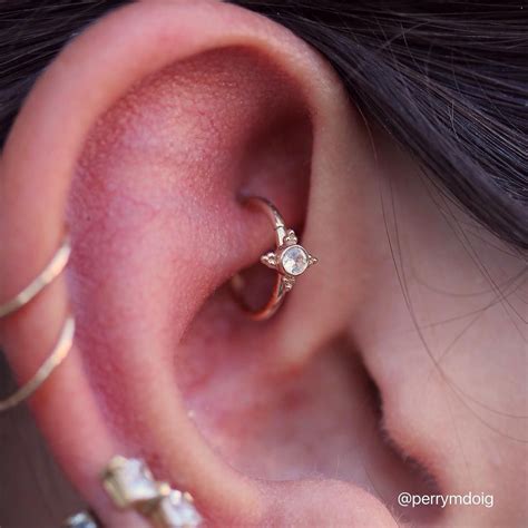 Healed rook piercing upgrade featuring a white sapphire in gold "Mini ...