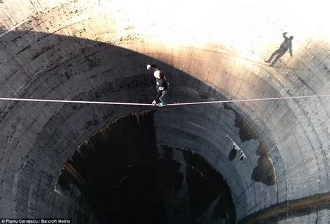 Slack-liner tip-toes across Romanian drain hole above 200ft blackhole ...