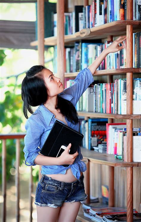 woman, blue, sport shirt, reaching, book, bookcase, girl, library | Piqsels