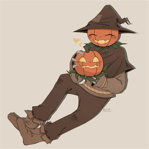 a man in a witches hat holding two pumpkins