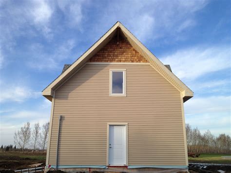 Cedar shakes and a corbel complete the exterior look of the home ...