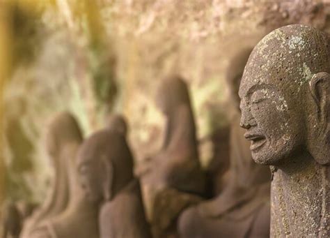 Premium Photo | Close-up on the face of a buddhist stone statues of an arhat or arahant monk in ...