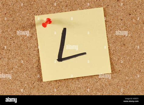 Message cork board with alphabet letters Stock Photo - Alamy