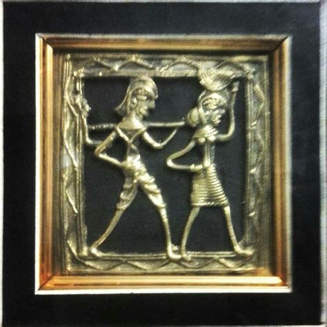 an ornate gold and black frame with two people