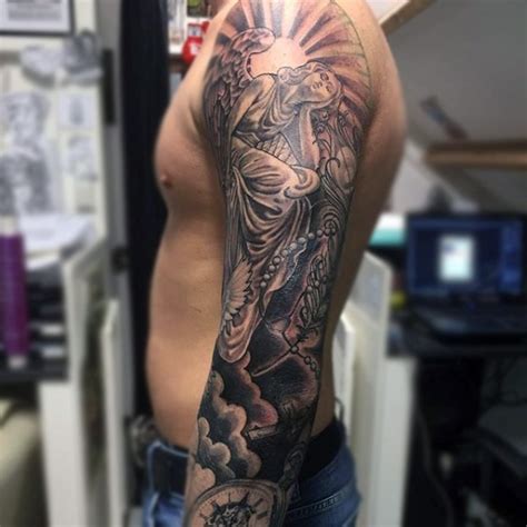 Antic style black and white angel statue tattoo on sleeve with pigeon ...