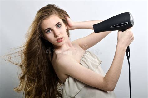 Beautiful Girl with Hair Dryer in Studio Stock Image - Image of nose, building: 108300615