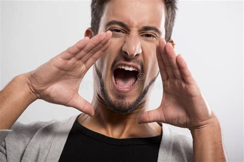 Young man shouting stock photo. Image of grey, portrait - 36229410