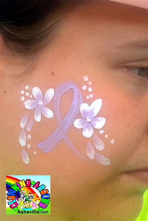 Simple Ribbon & Flowers Cheek Art for Relay for life Face Painting Easy, Face Painting Designs ...
