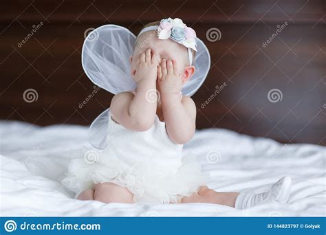 Happy Little Baby with Angel Wings Stock Image - Image of folded, beautiful: 144823797