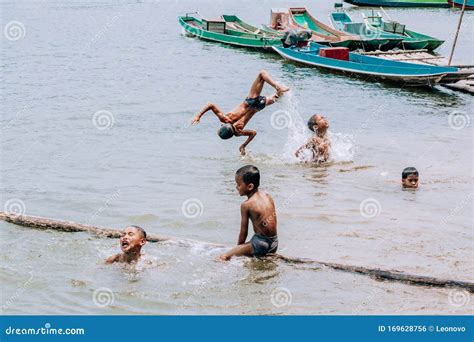 Nong Khiaw, Laos - May 2019: Lao Boys Having Fun in Mekong River ...