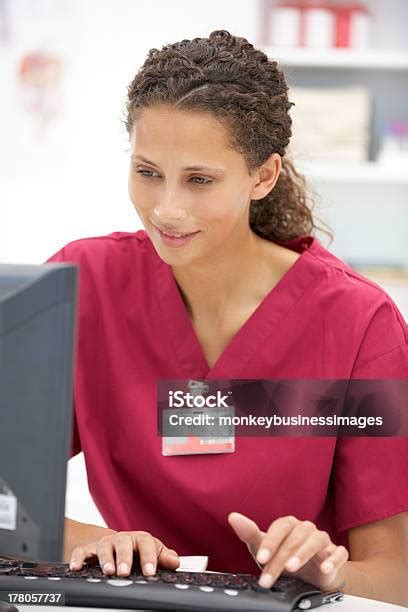 Young Hospital Doctor At Desk Stock Photo - Download Image Now ...