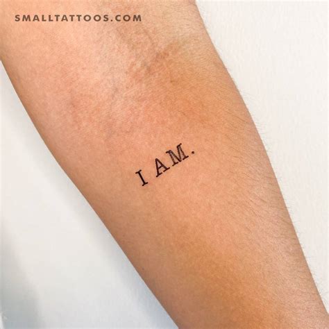 "I AM" temporary lettering tattoo placed on the inner