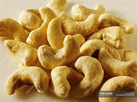 Raw Cashew nuts in heap — Healthy Eating, unprocessed - Stock Photo | #151254648