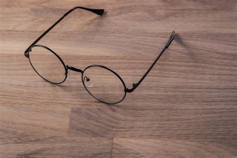 Premium Photo | Vintage reading glasses on the wooden surface