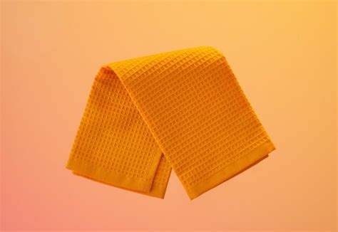 Premium Photo | Bright clean yellow kitchen towel Working and cooking in the kitchen