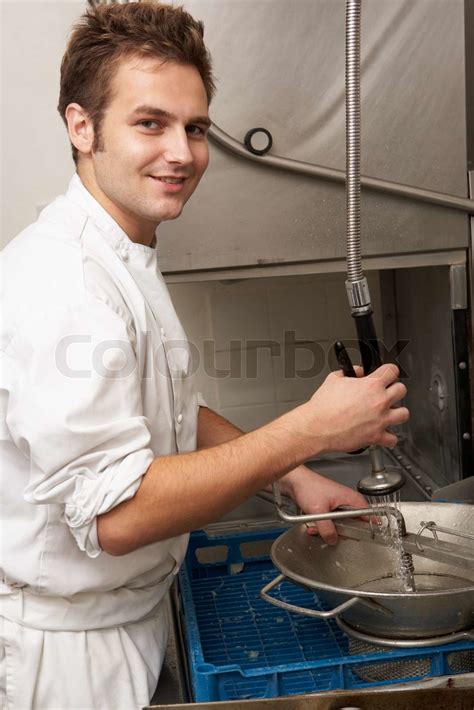 Kitchen Worker Washing Up In Restaurant Kitchen | Stock image | Colourbox