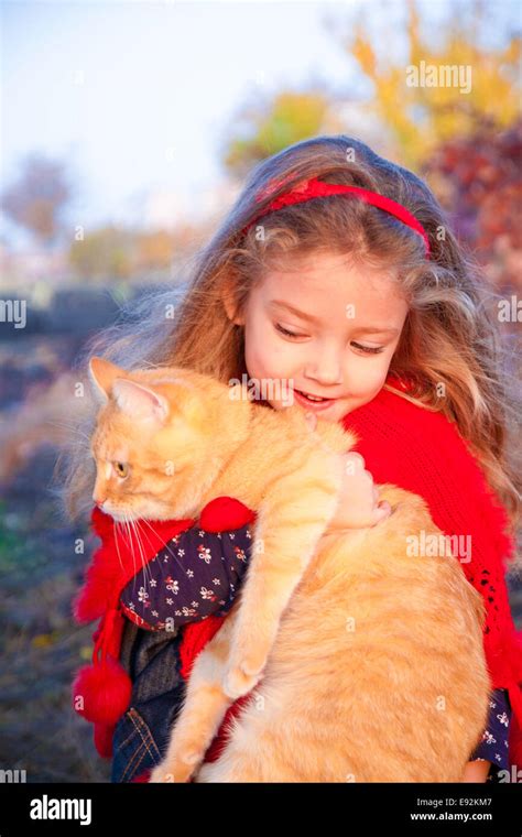 Little girl walking cat hi-res stock photography and images - Alamy