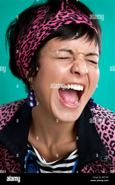 Colorful woman with mouth wide open Stock Photo - Alamy