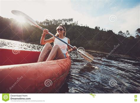 Young Woman Canoeing in a Lake Stock Image - Image of female, healthy ...