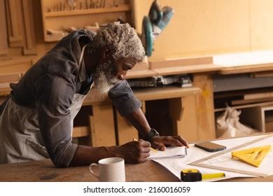 African American Mature Carpenter Drawing Diagram Stock Photo 2160016059 | Shutterstock