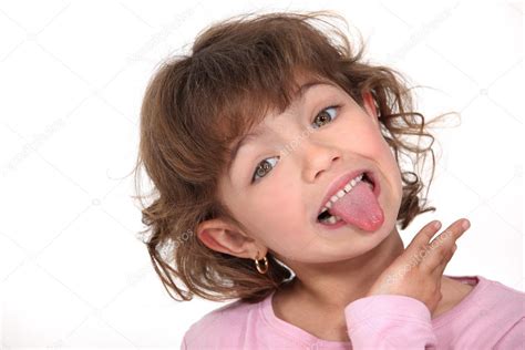 Little girl sticking tongue out ⬇ Stock Photo, Image by © photography33 #9767318