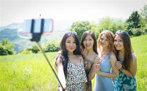 Group of Girls Making Selfie with Selfie Stick Stock Photo - Image of airiness, japanese: 53924742