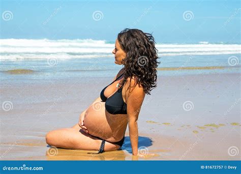 Happy Pregnant Woman on the Beach Stock Image - Image of girl, adult: 81672757